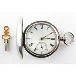 A full hunter pocket watch. Circular white dial with roman numerals. Key wound movement.