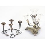 A silver-plated Art Nouveau four-trumpet epergne and another with four glass trumpets on raised