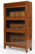 A Globe Wernicke style oak cabinet, 20th century, with three glazed stackable sections,