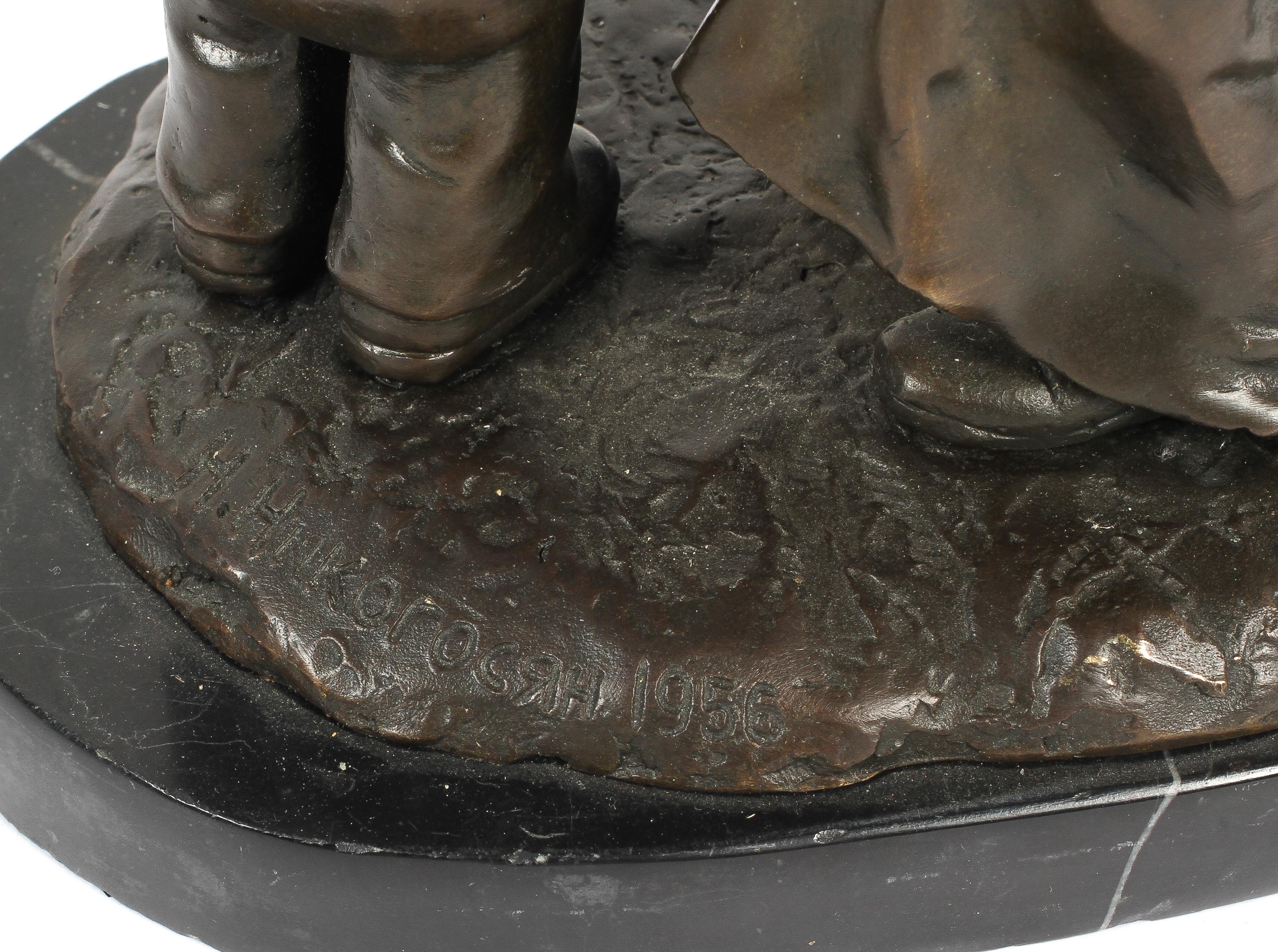 Bronze sculpture of an officer and child on a rocky mound and black marble base, - Image 3 of 3