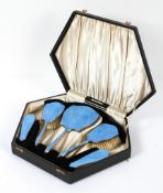 An Art Deco silver-mounted blue guilloche enamel dressing table set,