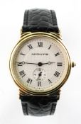 A gold plated mappin and webb 'The Meridian' quartz wristwatch. Circular dial with roman numerals.