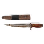 A vintage bayonet , WWII period, with leather and metal scabbard and turned wooden handle,
