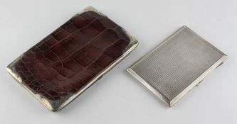 A George V silver mounted crocodile skin purse, hallmarked for London 1910,