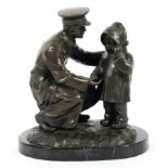 Bronze sculpture of an officer and child on a rocky mound and black marble base,