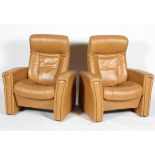 Two Fjords (Norwegian) reclining chairs, upholstered in pale tan leather style fabric,