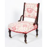 A Victorian walnut framed nursing chair, with floral upholstered back and seat,