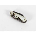 A miniature penknife, with a blade, corkscrew, pick and mother of pearl handle,