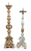 Two renaissance style pricket candlesticks, one gilded the other silvered,