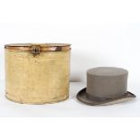 A vintage Young's grey top hat, in a tin hat box,