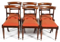 A set of six William IV dining chairs, with curved top rail and foliate back rail,