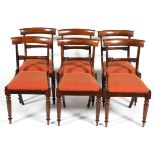 A set of six William IV dining chairs, with curved top rail and foliate back rail,