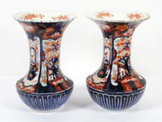 A pair of Japanese Imari vases, late 19th century, of fluted flared form,