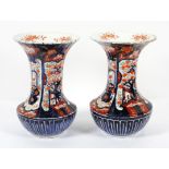 A pair of Japanese Imari vases, late 19th century, of fluted flared form,