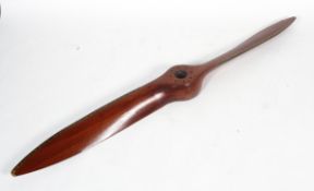 A mahogany and brass mounted two blade propeller from a De Havilland Gipsy Moth, with eight holes,