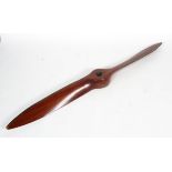 A mahogany and brass mounted two blade propeller from a De Havilland Gipsy Moth, with eight holes,