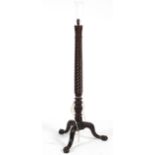 A mahogany 'bed post' standard lamp with tripod base,