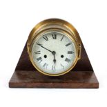 A brass ship's bulkhead clock on oak mount, early 20th century,