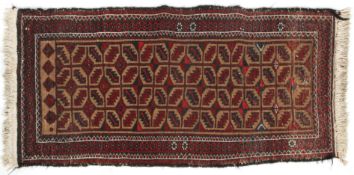 A Middle Eastern wool rug, 20th century, with brown, red and pink geometric ornament,