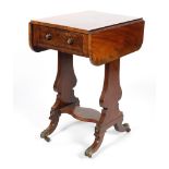 A 19th century mahogany work table, with folding top above a frieze drawer, on lyre shaped supports,
