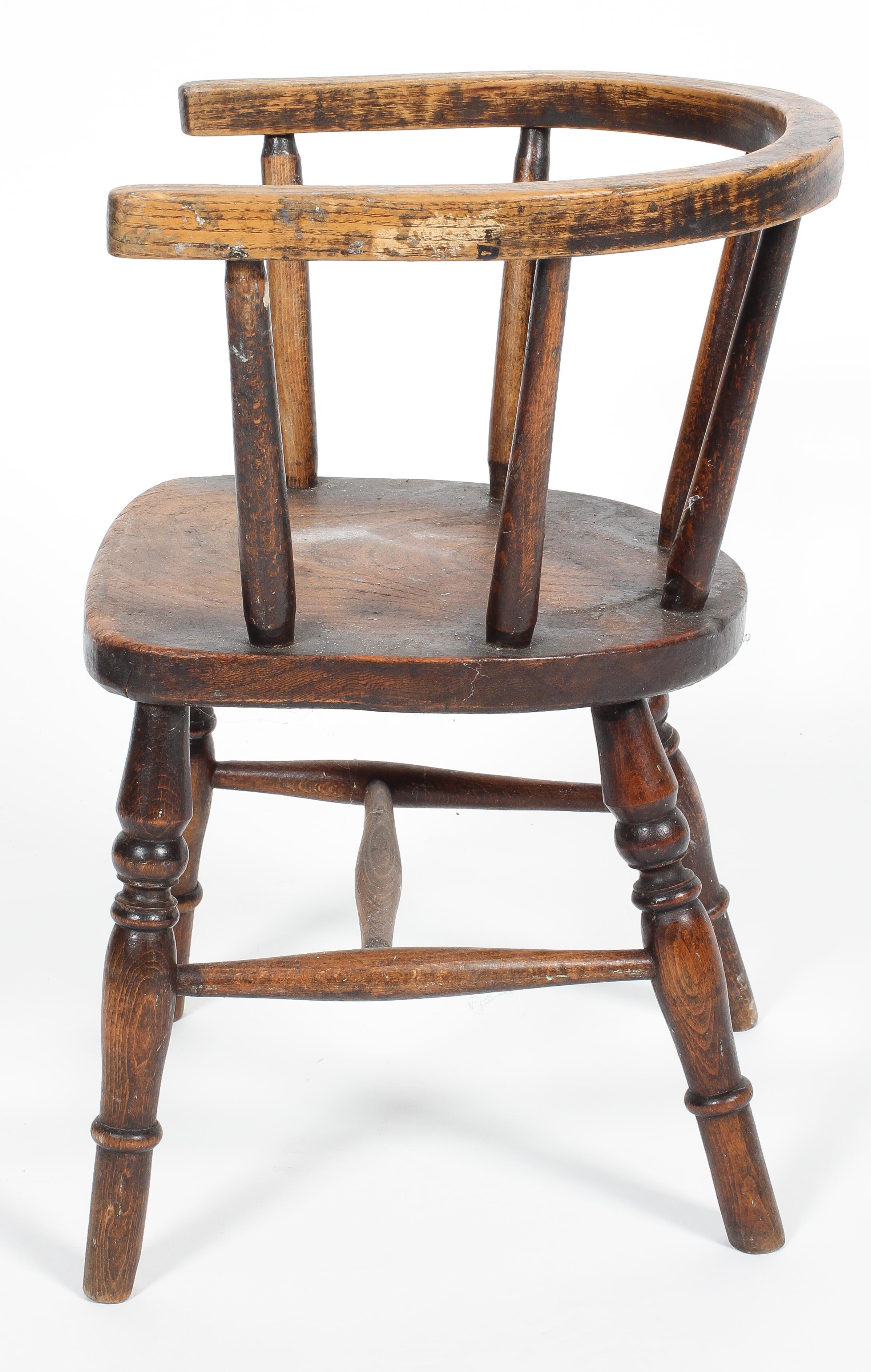 A child's oak chair, with horseshoe shaped back rail and spindle back on turned baluster legs, - Image 2 of 2