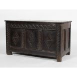 A 17th century oak coffer, of panelled construction,