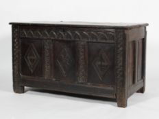 A 17th century oak coffer, of panelled construction,