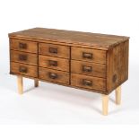An early/mid 20th century vintage oak nine drawer sideboard with index card holder handles,