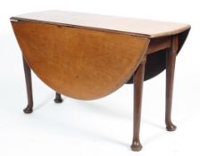 A Queen Anne style oval, mahogany gateleg dining table, on tapering legs with pad feet,