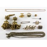 A collection of miscellaneous costume jewellery to include brooches, chains,