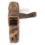 Tribal Art: A carved wooden figural plane, possibly Polynesian,