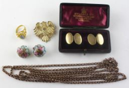 A collection of costume jewellery to include: A long guard chain; A brooch;