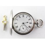 A full hunter pocket watch. Circular white dial with roman numerals. Key wound movement.