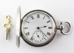 A full hunter pocket watch. Circular white dial with roman numerals. Key wound movement.