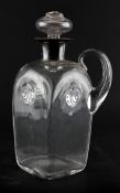 A silver collared spirit decanter and stopper, with loop handle and spiral ornament,