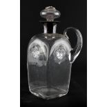 A silver collared spirit decanter and stopper, with loop handle and spiral ornament,
