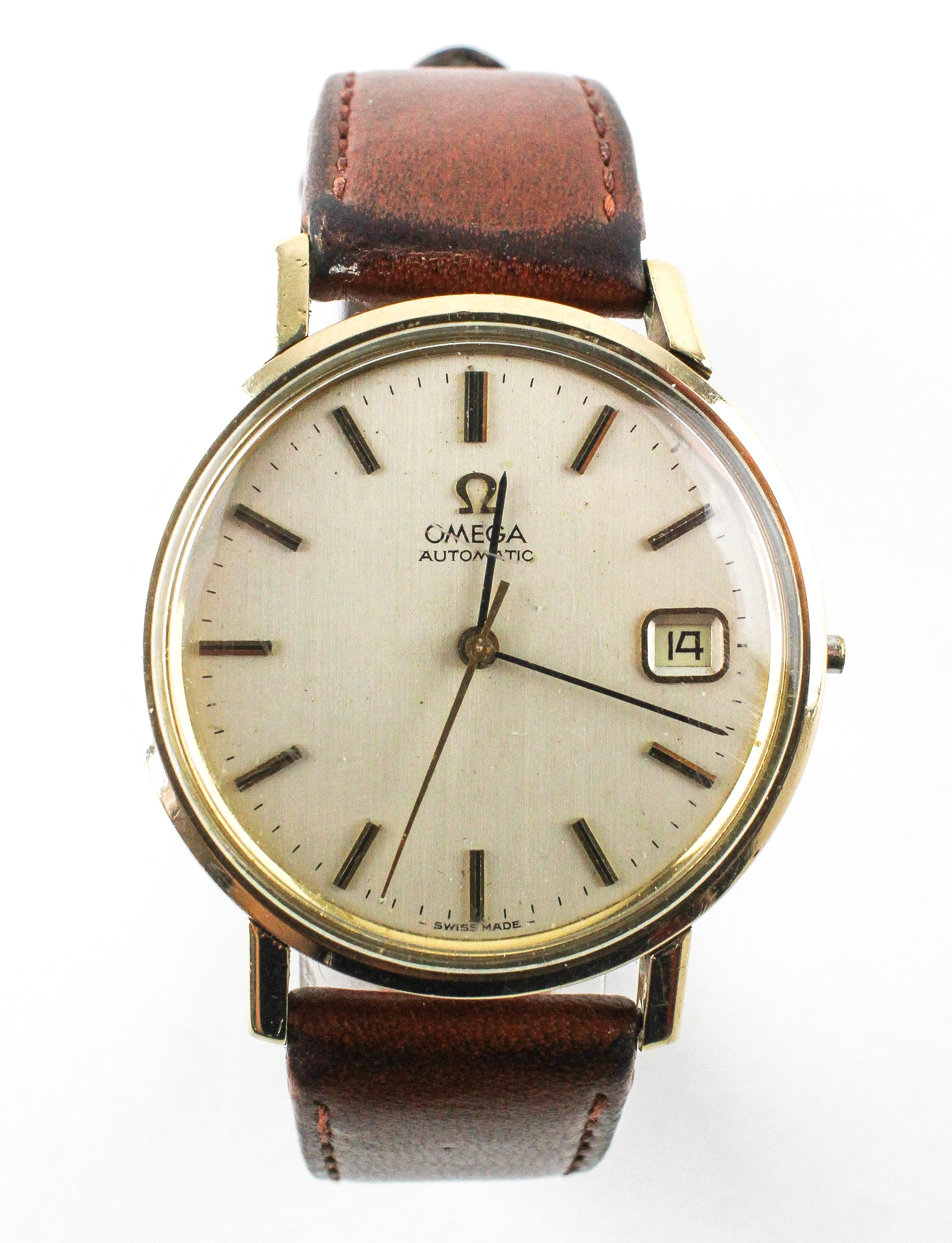 A yellow metal omega automatic wristwatch.