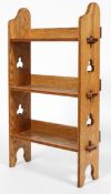 An Arts and Crafts Liberty style oak three tier small bookcase,