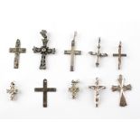 A collection of ten silver cross pendants of variable designs. Most are marked silver and/or 925.