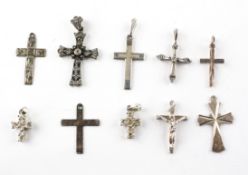 A collection of ten silver cross pendants of variable designs. Most are marked silver and/or 925.