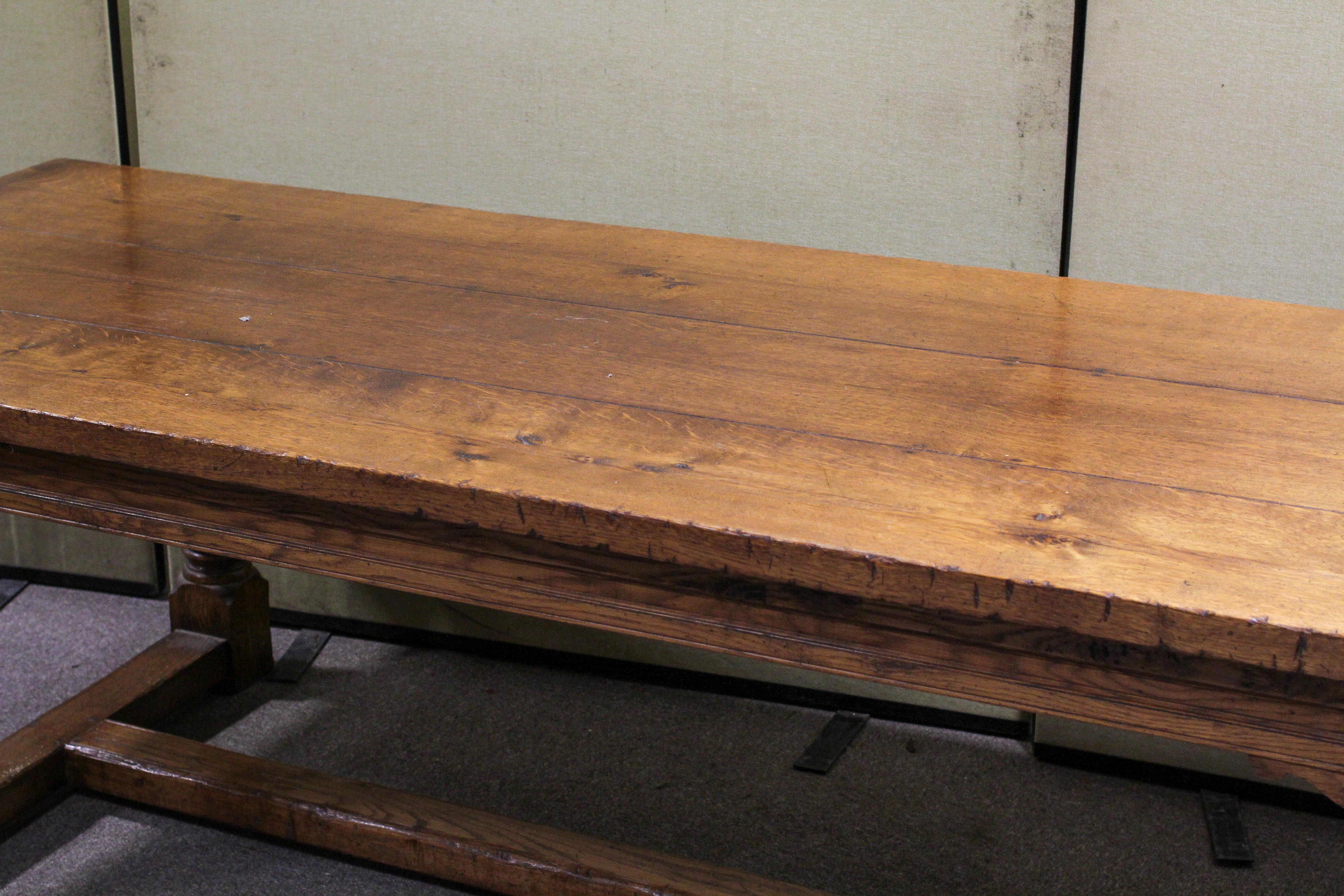 A large oak refectory table, on four large turned supports joined by plain stretchers, - Image 2 of 3