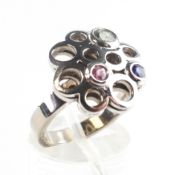 A white metal gemstone set "Carousel" ring. Hallmarked 18ct gold, Birmingham, 2016. Size L 8.