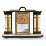 An art deco style clock garniture in alabaster and black slate or marble,