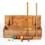 A croquet set by Jaques, including mallets, balls and stakes, in pine box,