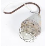A Hayes & Co 'The Wigan' lamp, with cage surround to the large bulb,