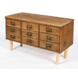 An early/mid 20th century vintage oak nine drawer sideboard with index card holder handles,