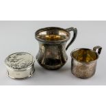 Two silver mugs, one being hallmarked Birmingham 1930 by A & J Zimmerman ltd,