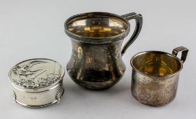 Two silver mugs, one being hallmarked Birmingham 1930 by A & J Zimmerman ltd,