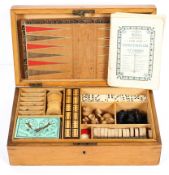 A Victorian boxed compendium of games, including two leather boards, pieces for chess, bezique,