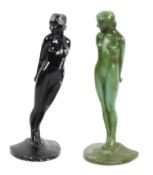 A pair of Art Deco metal book ends cast as naked ladies holding balls behind them,